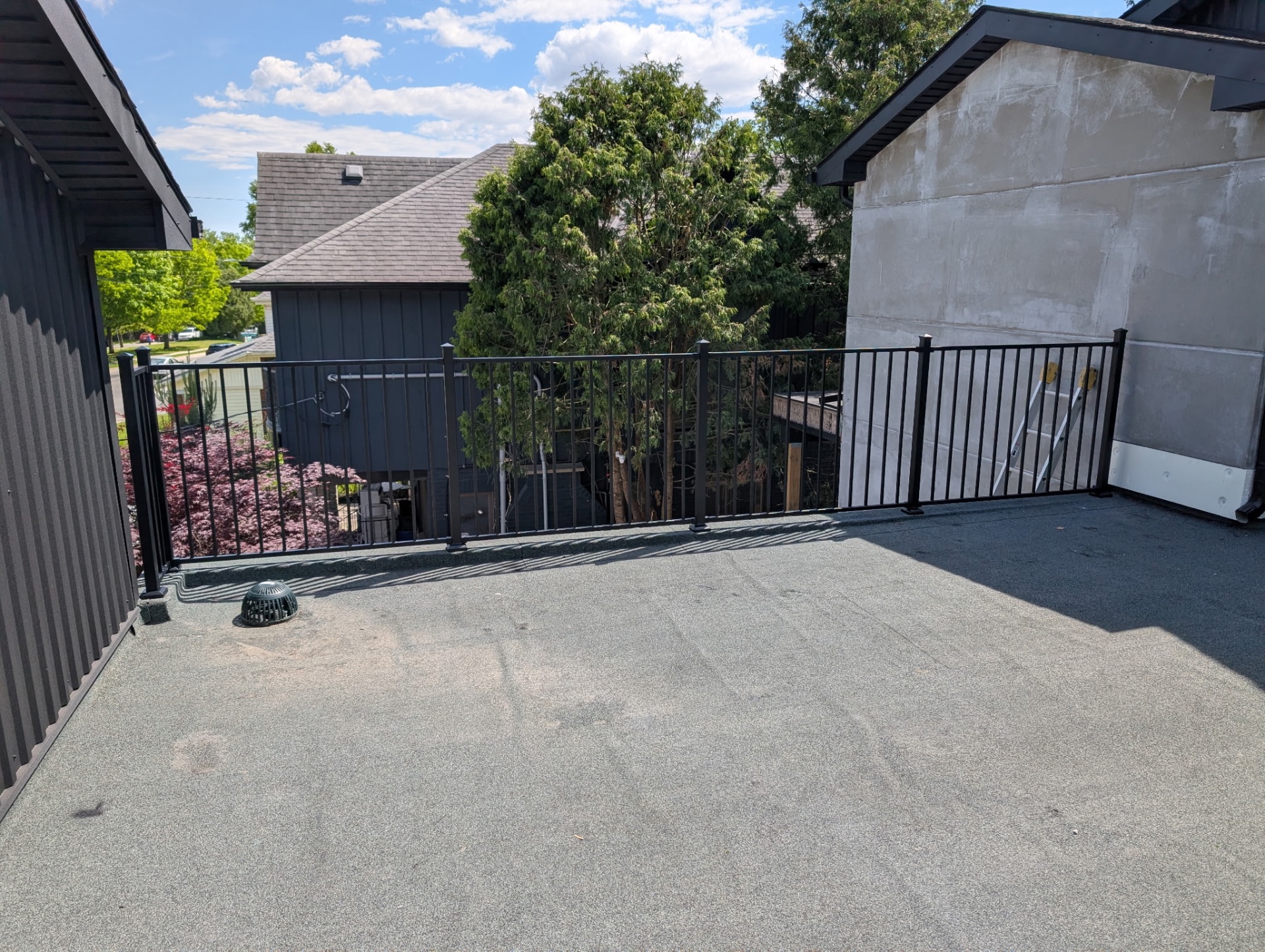 Rooftop deck with black metal railings